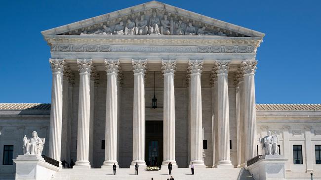 Workers prepare for a memorial service for Ruth Bader Ginsburg at the US Supreme Court. Picture: AFP.