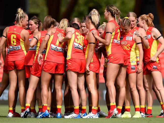 Suns players huddle during the round one AFLW match between the Gold Coast Suns and the Melbourne Demons at Metricon Stadium on January 30, 2021 in Gold Coast, Australia. Picture: Matt Roberts