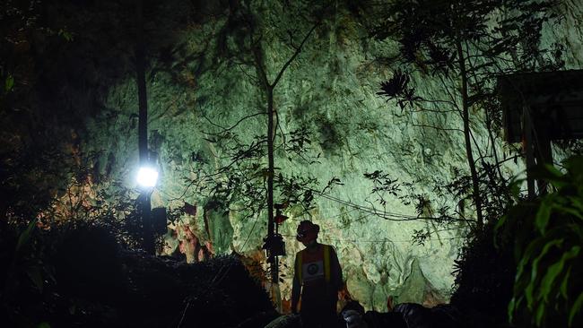 A Thai technician emerges from the mouth of Tham Luang cave during the rescue mission on July 2. Picture: AFP