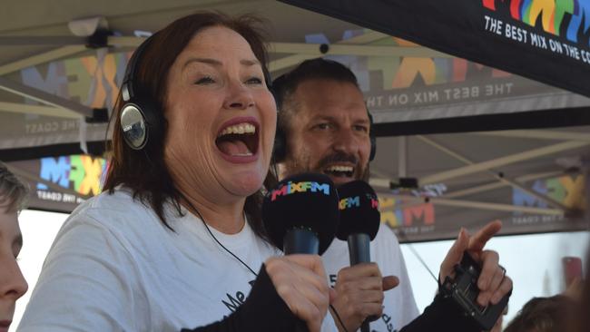 An emotional moment as 92.7 Mix FM breakfast announcers Caroline Hutchinson and Mark Darin discover they smashed a $600,000 fundraising goal for the Give Me 5 for Kids appeal.