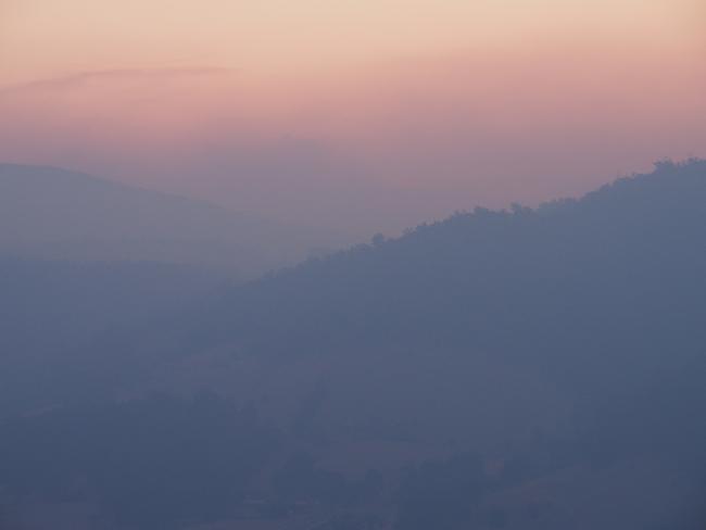 Bushfire smoke hangs over the Huon Valley, south of Hobart, sparking an alert from the Tasmania Fire Service. Picture: DAVID KILLICK