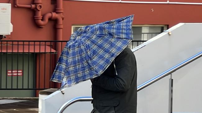 Kais Dahdal scurrying away from Wollongong Courthouse on Tuesday. Picture: Dylan Arvela