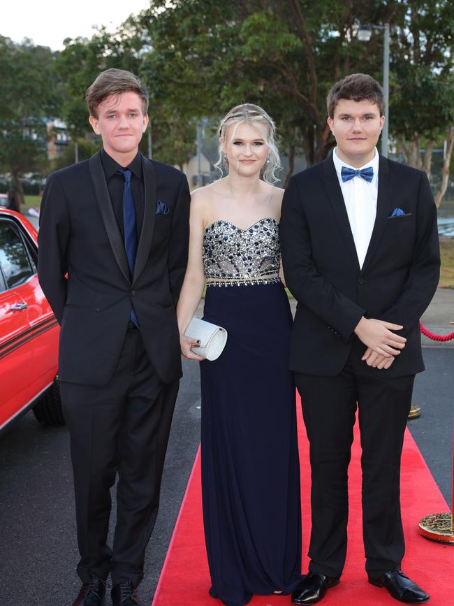 Pacific Pines High formal, at the school. Mark Guthrie, Haylie Reichle & Daniel Prince Picture Glenn Hampson