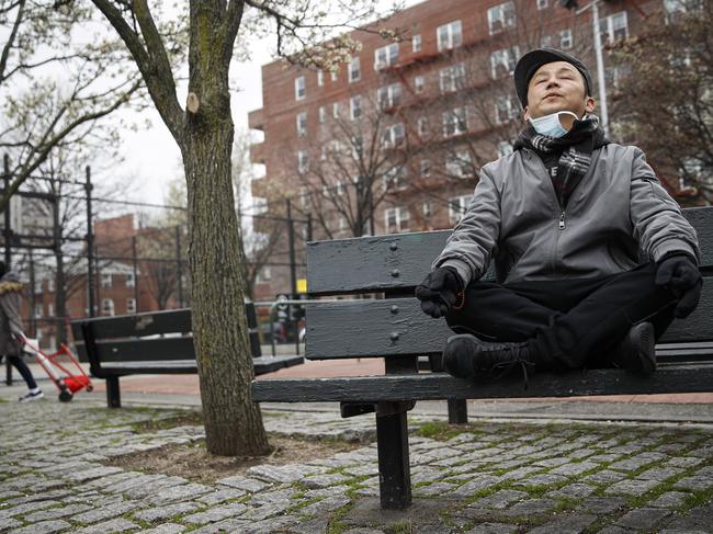 A New Yorker practices meditation as the city looks ahead to another four weeks – at least – of strict lockdown. Picture: AP