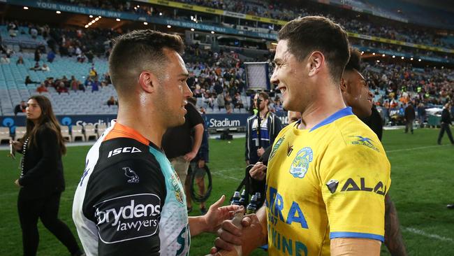 SYDNEY, AUSTRALIA — JULY 23: Mitchell Moses of the Eels shakes hands with Luke Brooks of the Tigers following the round 20 NRL match between the Wests Tigers and the Parramatta Eels at ANZ Stadium on July 23, 2017 in Sydney, Australia. (Photo by Brendon Thorne/Getty Images)