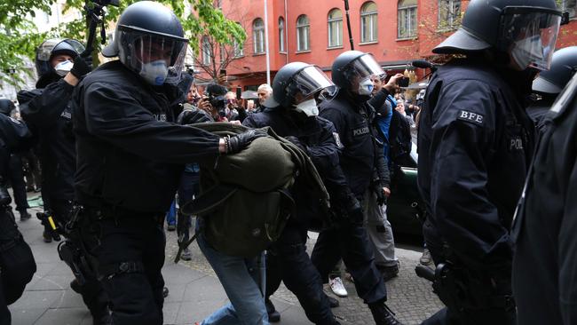 Police arrest a demonstrator in Berlin. Picture: Getty Images