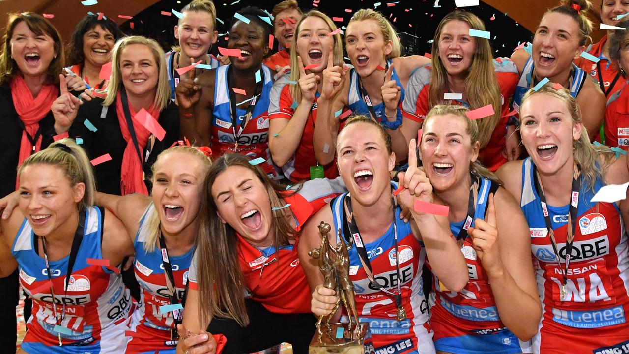 Swifts players celebrate winning the Super Netball Grand Final match between the Sunshine Coast Lightning and the New South Wales Swifts at the Brisbane Entertainment Centre in Brisbane, Sunday, September 15, 2019. (AAP Image/Darren England) NO ARCHIVING, EDITORIAL USE ONLY