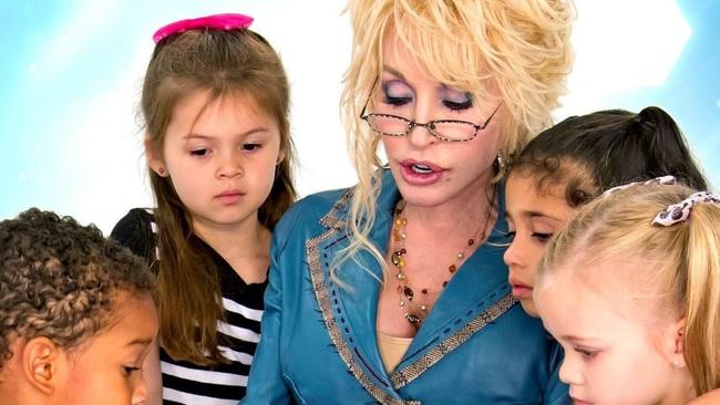 Dolly Parton reading with children.