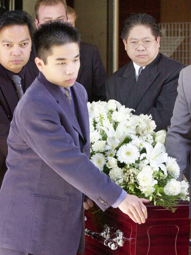 Gonzales holds his father’s coffin at the funeral for his murdered parents and sister. File picture