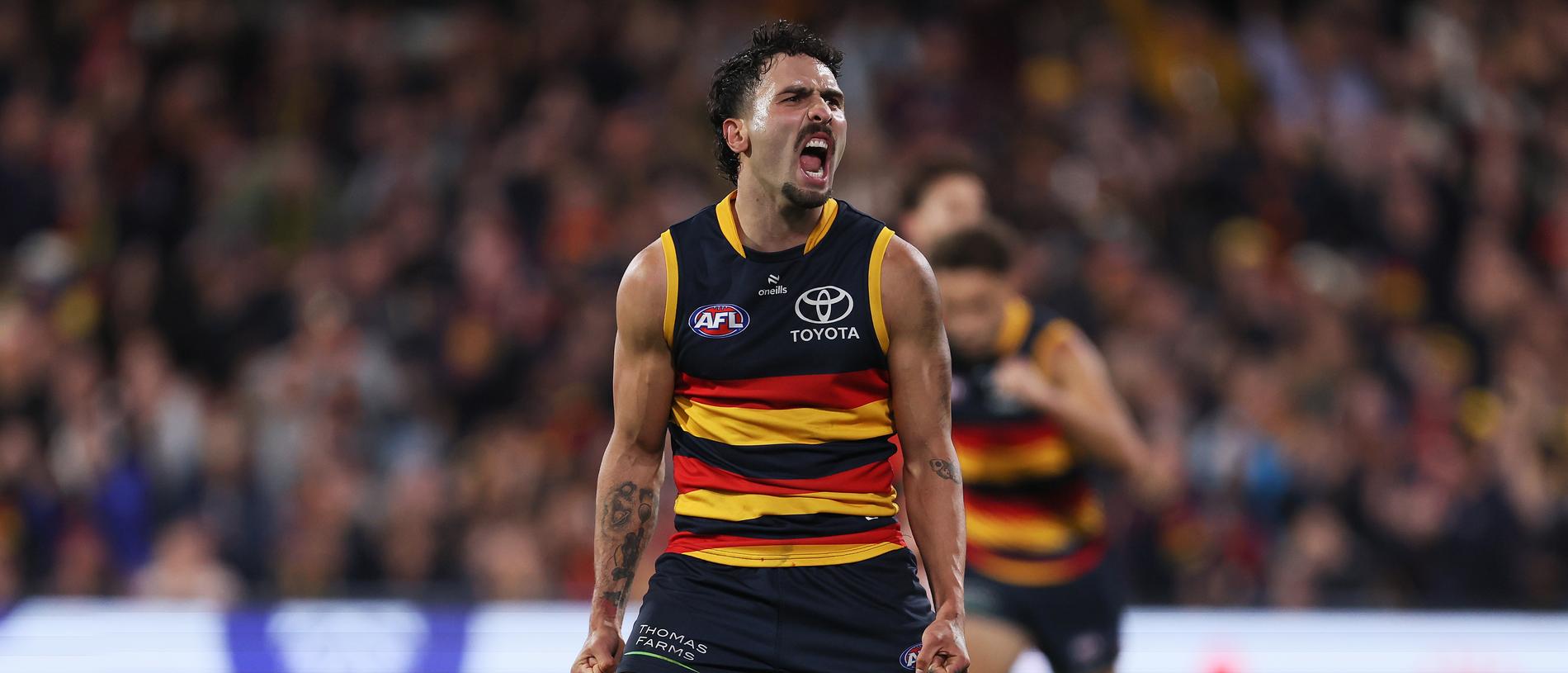 ADELAIDE, AUSTRALIA - APRIL 19: Izak Rankine of the Crows celebrates a goal during the 2024 AFL Round 06 match between the Adelaide Crows and the Essendon Bombers at Adelaide Oval on April 19, 2024 in Adelaide, Australia. (Photo by James Elsby/AFL Photos via Getty Images)