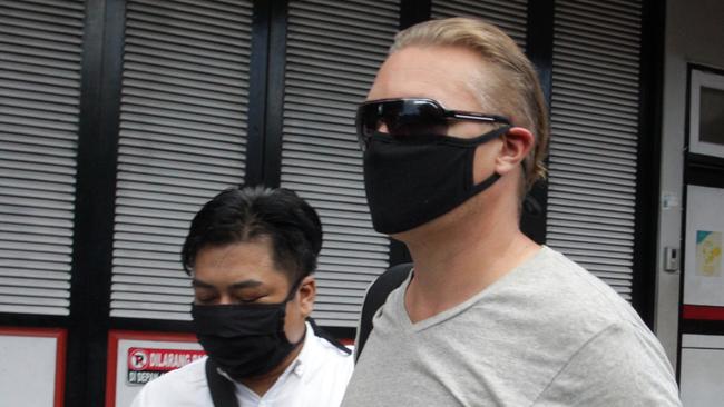 "NEWS360 PREMIUM LOCKED CONTENT: NO NEWS.COM, NO SKYNEWS, NO WEST AUSTRALIAN, NO AUSTRALIAN"Australian David Van Iersel escorted by Immigration officer as he release after serving 9 month Kerobokan jail. David and his friend William Cabantog were allegedly in posession 1.12 grams cocaine at Lost City Night Club in Canggu, North Kuta on July last year. (Picture. Lukman S. Bintoro)