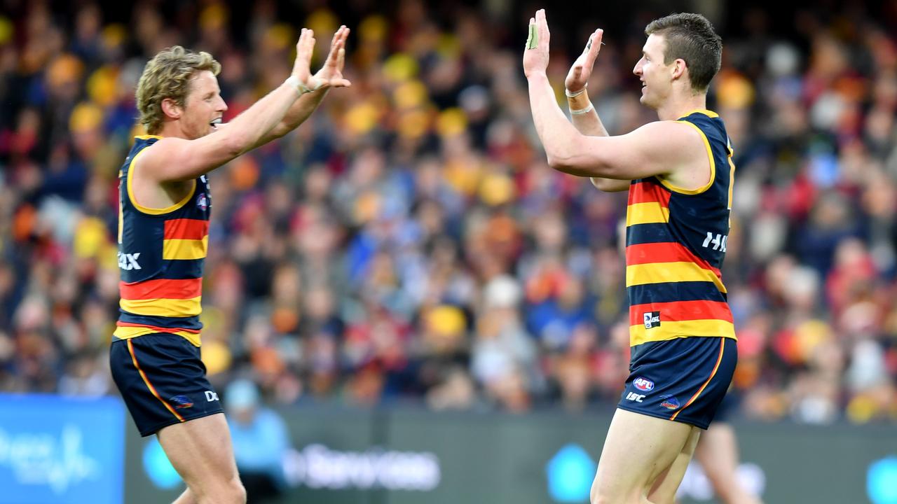 Rory Sloane and Josh Jenkins celebrate a goal in Round 22.