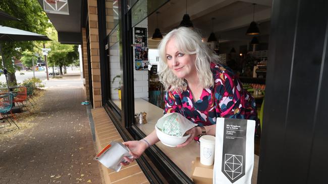 My Kingdom for a Horse owner Emily Raven at the cafe window with a packed lunch. Her Distance Dining initiative allows people to grab their order, tap-to-pay and go. Picture: Tait Schmaal