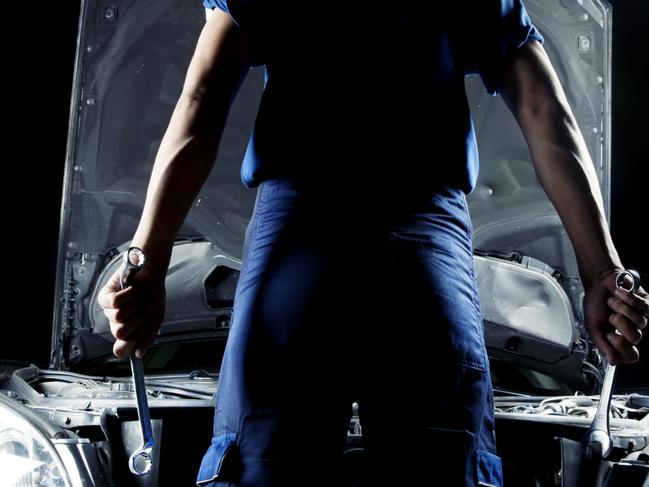 Generic Thinkstock image of serviceman car mechanic with motor car.