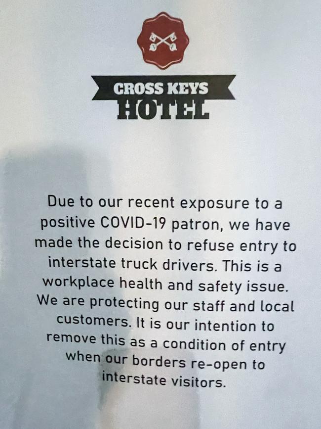 The sign on the door at the Cross Keys Hotel, banning interstate truck drivers amid Covid fears. Picture: Matt Turner