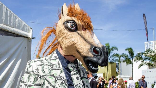 Greg Williams wearing his horse head at the Magic Millions race day on Saturday at the Gold Coast Turf Club. Picture: Jerad Williams