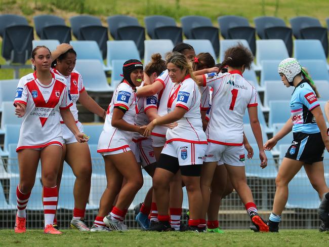 The Dragons celebrate a try during last year’s competition. Photo: Jeremy Ng