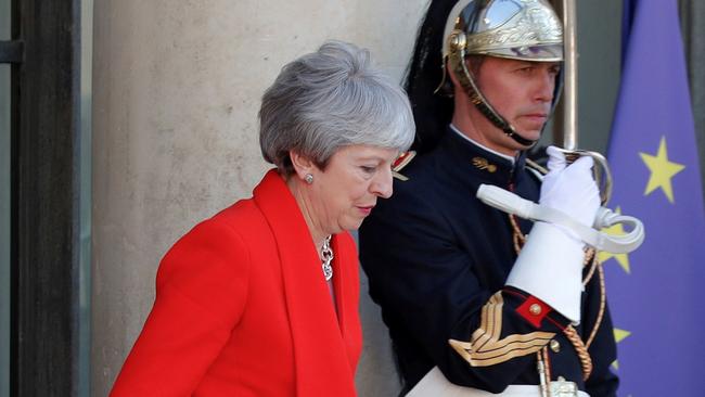 British Prime Minister Theresa May leaves the Elysee presidential Palace in Paris on May 15, 2019 after attending a launching ceremony for the 'Christchurch call', an initiative pushed by New Zealand's Prime Minister after a self-described white supremacist gunned down 51 people in a massacre at two mosques in March. - French President and New Zealand's premier host other world leaders and leading tech chiefs to launch an ambitious new initiative aimed at curbing extremism online. The political meeting runs in parallel to an initiative launched by French President called Tech for Good which will bring together 80 tech chiefs in Paris to find a way for new technologies to work for the common good. (Photo by CHARLES PLATIAU / POOL / AFP)