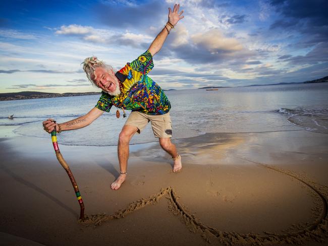 Mark Watterson at Bellerive Beach with his message stick. Picture: LUKE BOWDEN