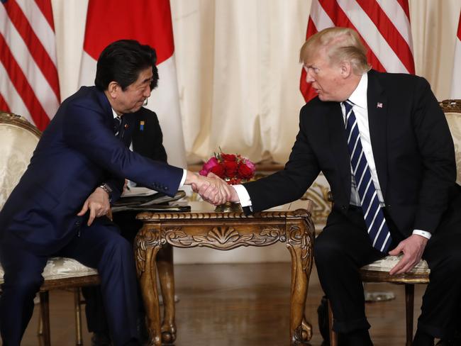 President Donald Trump and Japanese Prime Minister Shinzo Abe shake hands during a meeting at Trump's private Mar-a-Lago club. Picture: AP Photo/Pablo Martinez Monsivais