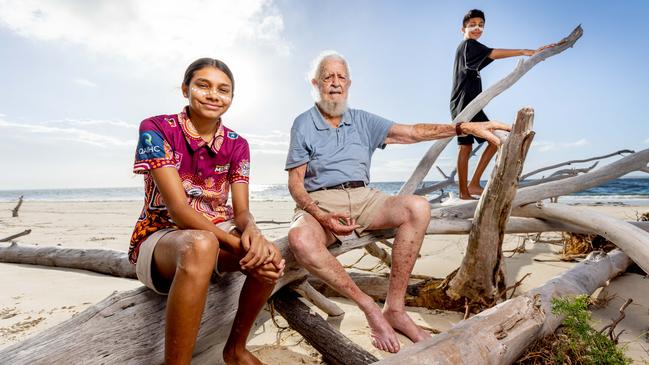 Quandamooka elder Uncle Bob Anderson, 92, on Stradbroke Island with Ruby Delaney-Law, 14, and her brother Charlie, 13. Picture: Luke Marsden