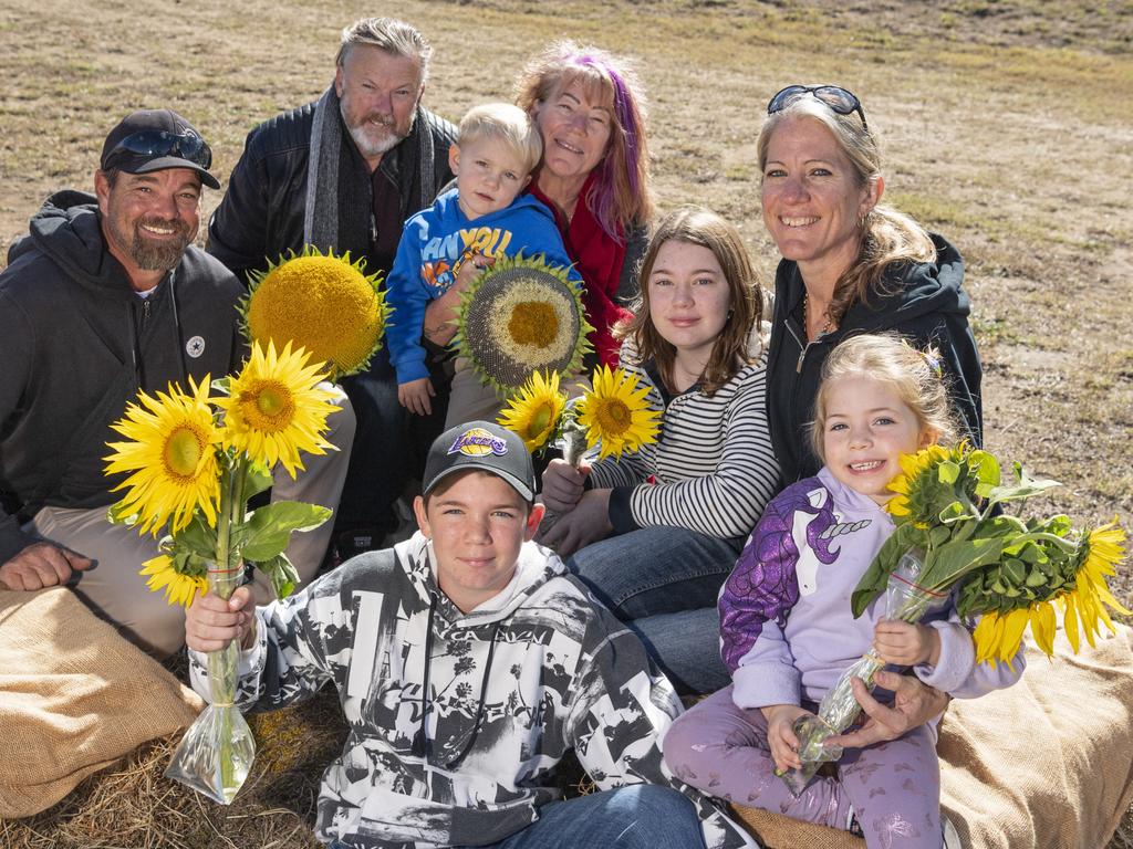 Having a great time are (from left) Alan Luttgens, Rory Woods, Kaidyn Luttgens, Heike Woods, Noah Luttgens (front), Hannah Luttgens, Bec Luttgens and Mahalia Luttgens at the picnic with the sunflowers event hosted by Ten Chain Farm, Saturday, June 8, 2024. Picture: Kevin Farmer