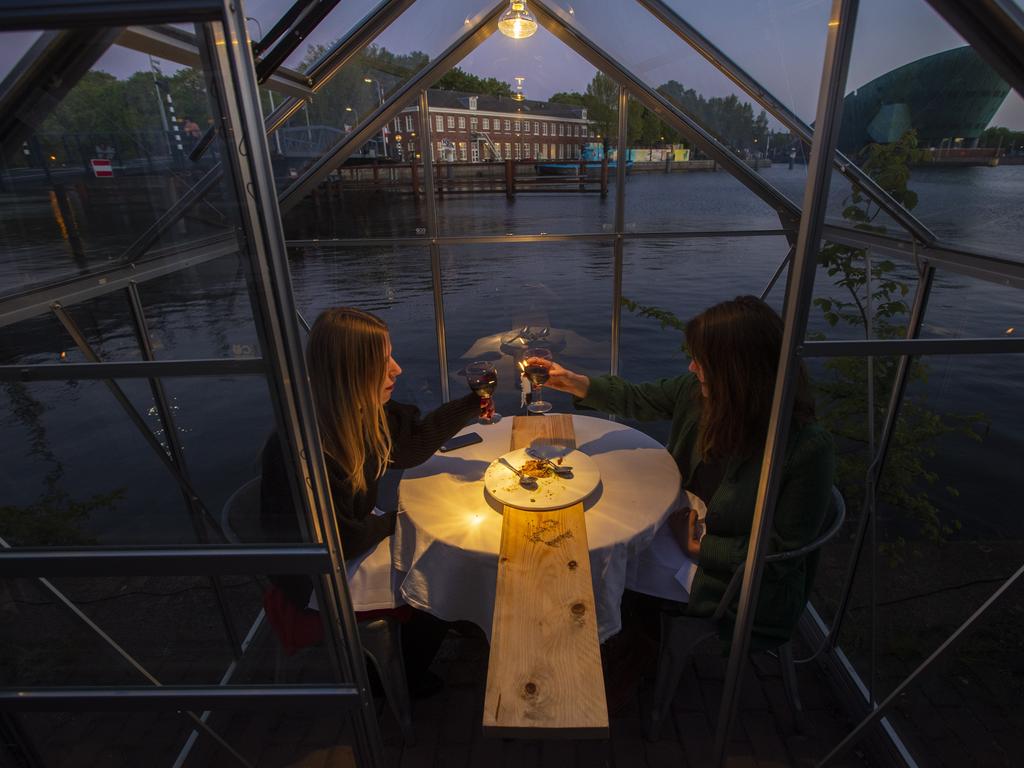 The Mediamatic restaurant allows diners to sit in small glasshouses. Picture: AP Photo/Peter Dejong