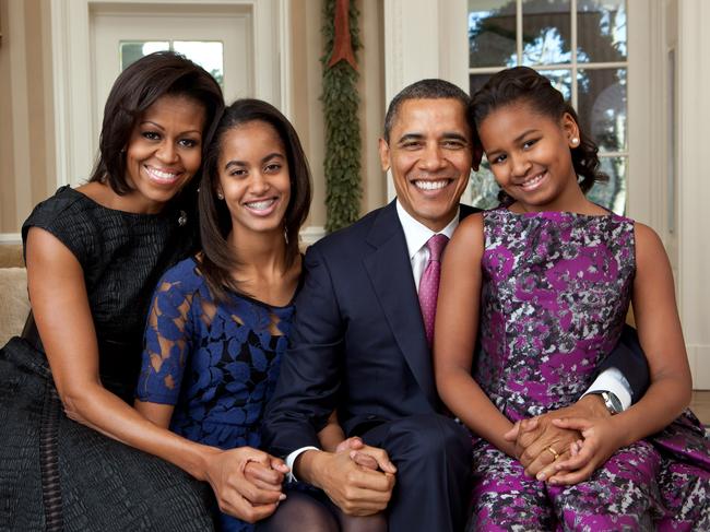 President Barack Obama, First Lady Michelle Obama, and their daughters, Sasha and Malia, sit for a family portrait in the Oval Office on December 11, 2011.Picture: Pete Souza/The White House