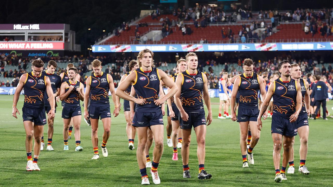 Crows players look dejected after the loss. Picture: Michael Willson/AFL Photos via Getty Images