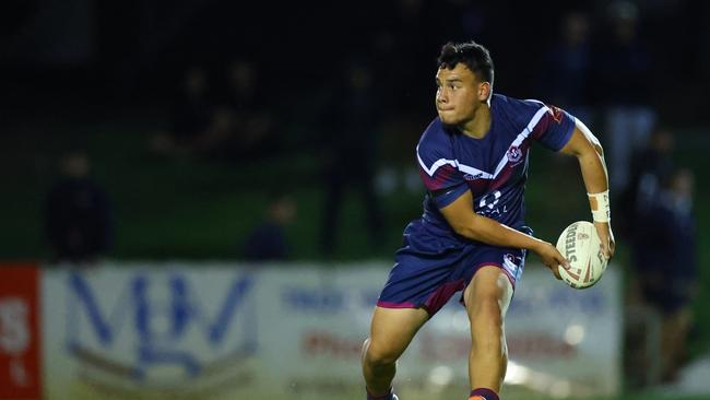 Isiah Mafi of Ipswich SHS in the action.