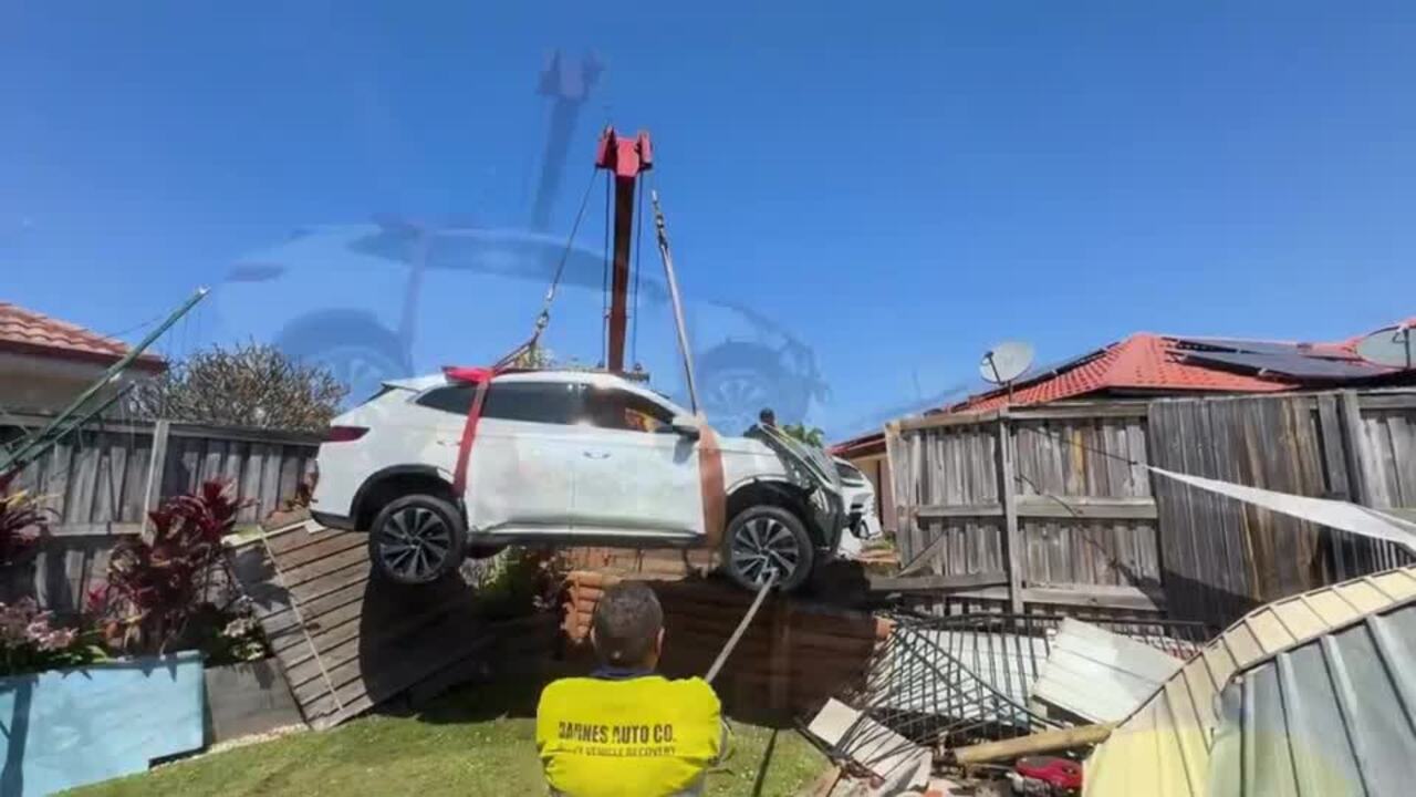 Car craned out after crashing into garden