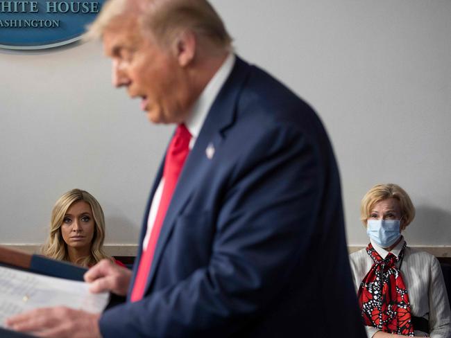 White House Press Secretary Kayleigh McEnany, left, sits next to Response co-ordinator for White House Coronavirus Task Force Deborah Birx, as they listen to US President Donald Trump. Picture: AFP