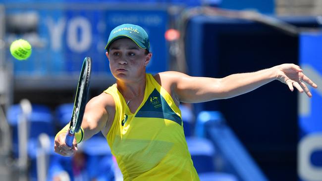 (FILES) In this file photo taken on July 25, 2021 Australia's Ashleigh Barty returns a shot to Spain's Sara Sorribes Tormo during their Tokyo 2020 Olympic Games women's singles first round tennis match at the Ariake Tennis Park in Tokyo. - World number one Ashleigh Barty, Angelique Kerber and US star Venus Williams have withdrawn from next month's WTA Montreal tournament, Tennis Canada announced July 29, 2021. (Photo by Tiziana FABI / AFP)