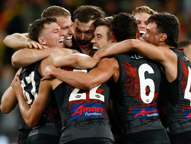 MELBOURNE, AUSTRALIA - MAY 20: Bombers players celebrates as the final siren sounds during the 2023 AFL Round 10 match between the Essendon Bombers and the Richmond Tigers at the Melbourne Cricket Ground on May 20, 2023 in Melbourne, Australia. (Photo by Michael Willson/AFL Photos via Getty Images)