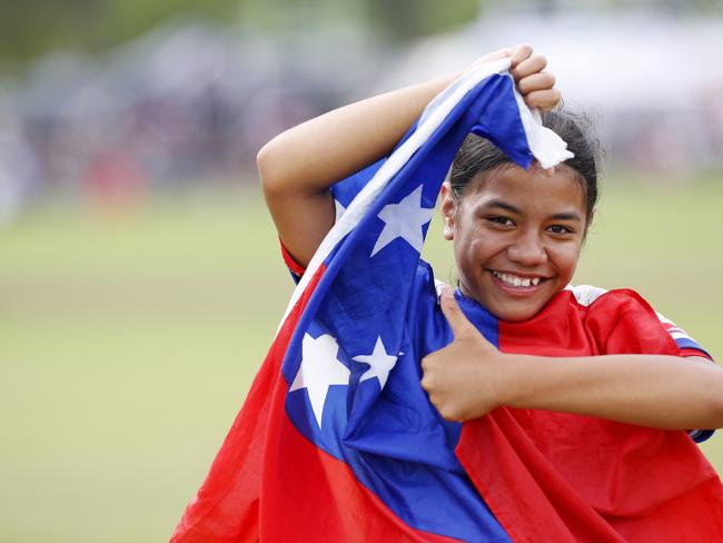 Under 12 Girls player from winning side NSW Samoa Ve'a Tavita proudly wears the Samoan flag. 2024 Pasifiika Cup Rugby Union at Whalan Reserve. Picture: John Appleyard