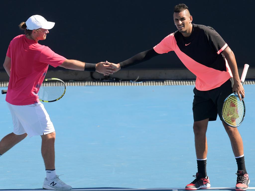 Matt Reid (left) knows Nick Kyrgios as well as anyone. Picture: Tracey Nearmy/AAP Image