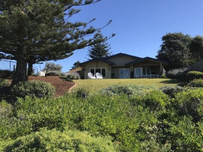 Image of the rear of the house and backyard.