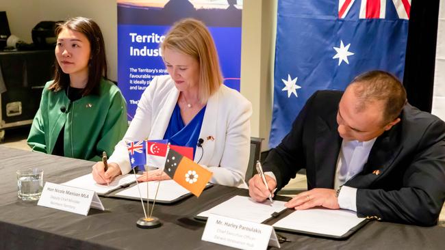 Deputy Chief Minister Nicole Manison and Darwin Innovation Hub chief executive Harley Paroulakis sign a memorandum of understanding to further the Territory's space industry. Picture: SUPPLIED