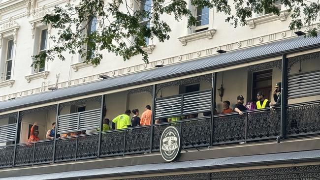 Protestors on the balcony of Irish Murphy's after the rally.