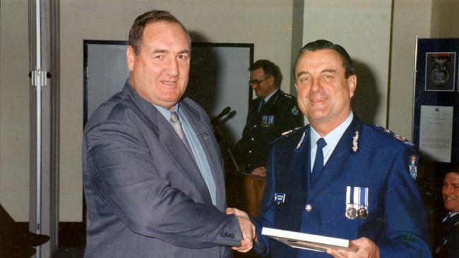 Warren Smithers with then Commissioner Jim O'Sullivan when he retired from the Queensland Police. Picture: Supplied