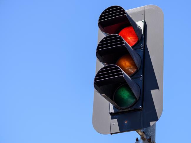A self-employed builder has had a lucky day in court, avoiding both a fine and conviction after going through two red lights.