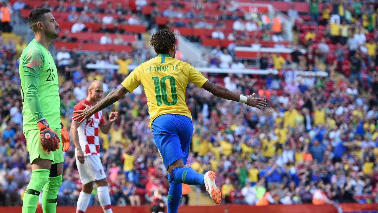Croatia's goalkeeper Danijel Subasic (L) reacts as Brazil's striker Neymar celebrates after scoring the opening goal