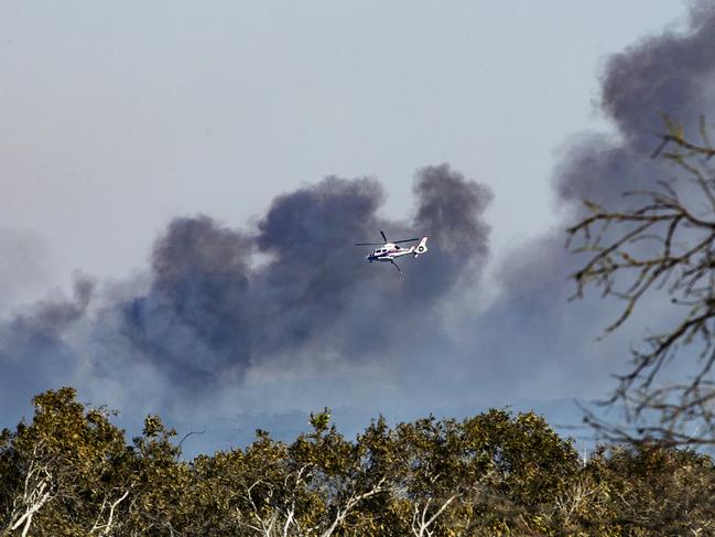 Water bombers continue to battle an out of control bushfire at Peregian Beach. Picture: Lachie Millard