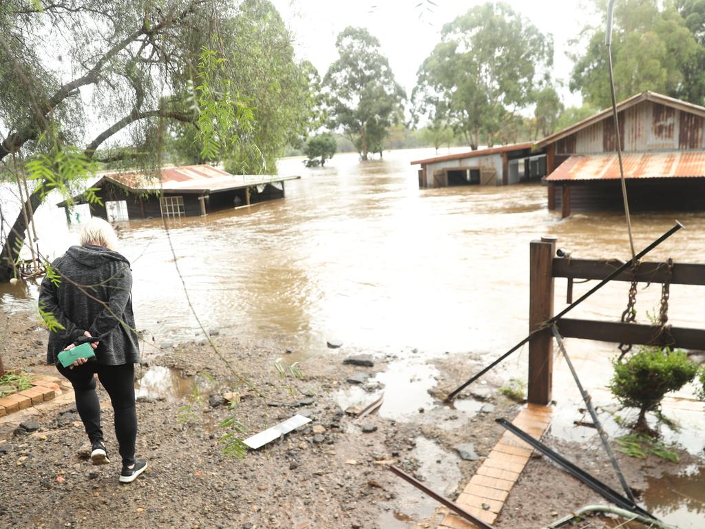 Camden a day after another flood in the area in two weeks .Phil Oliver ( cap) sevens damage on his property at 2 Exeter st Camden.