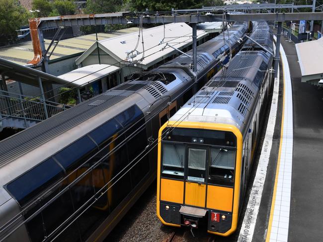 SYDNEY, AUSTRALIA - DECEMBER 07: Tangara type trains built in Australia run into Waverton Station on the Lower North Shore on December 07, 2021 in Sydney, Australia. Sydney train drivers are striking on Tuesday, joining bus drivers as part of ongoing industrial action of pay and safety concerns. (Photo by James D. Morgan/Getty Images)