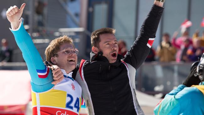 Hugh Jackman and Taron Egerton in a scene from the movie Eddie the Eagle. 20th Century Fox.