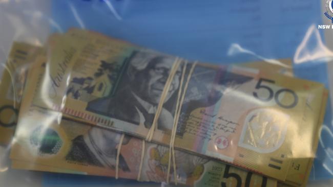 Cash seized in a raid by Strike Force Pallamana detectives in the Hunter Valley