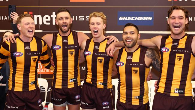 MELBOURNE, AUSTRALIA - JUNE 01: James Sicily, Jack Gunston, Cam Mackenzie, Jarman Impey and Jack Scrimshaw of the Hawks sing the song in the rooms after winning the round 12 AFL match between Hawthorn Hawks and Adelaide Crows at Melbourne Cricket Ground, on June 01, 2024, in Melbourne, Australia. (Photo by Quinn Rooney/Getty Images)