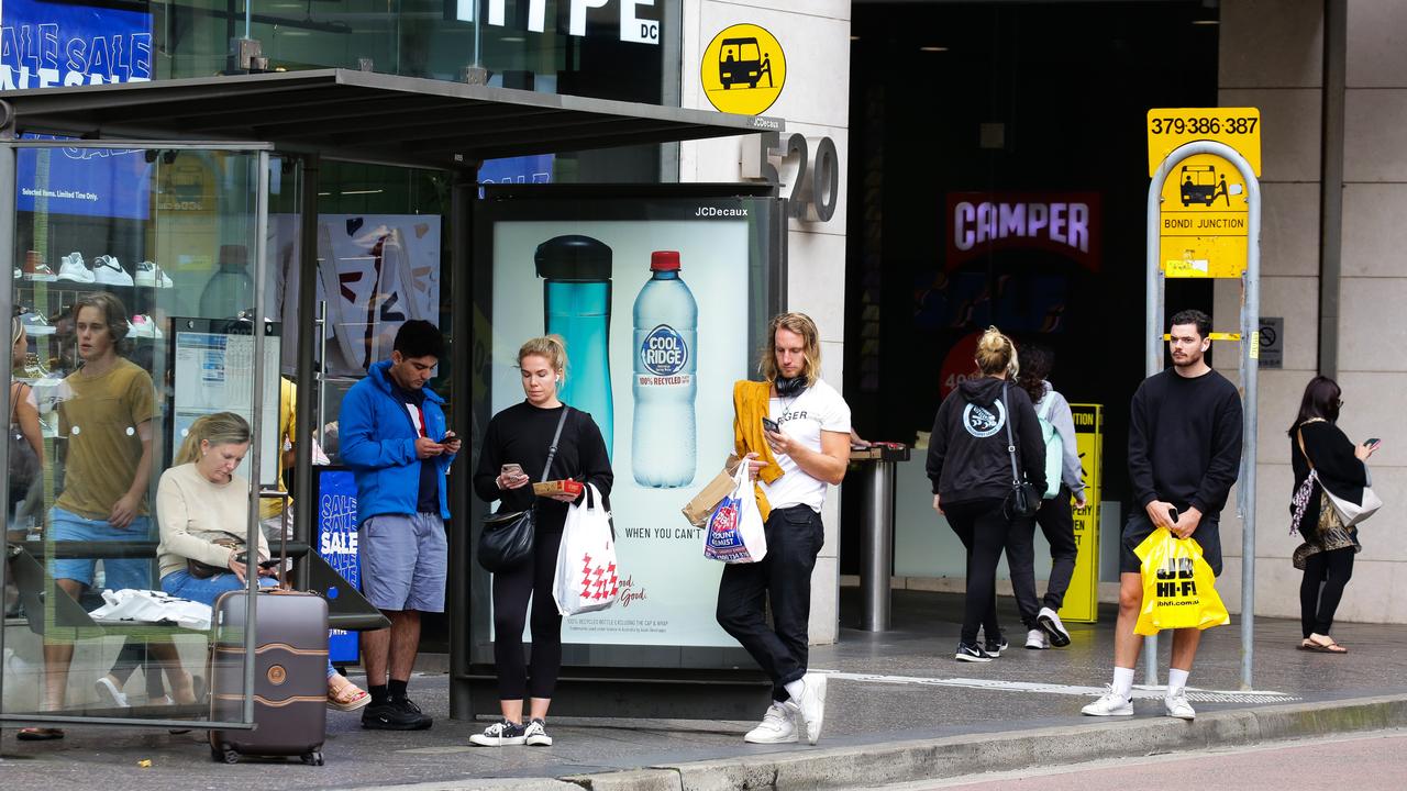 Sydneysiders waiting at the bus stop in Bondi Junction. Picture: NCA NewsWire/Gaye Gerard