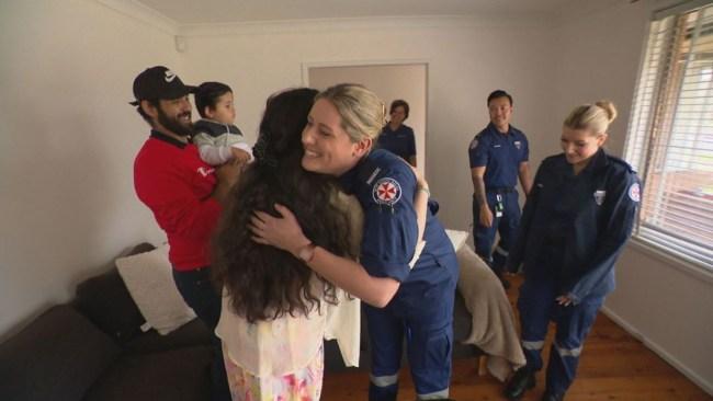 The Triple Zero operator and paramedics who helped deliver Alanna's daughter are re-united with the couple. Picture: 9News